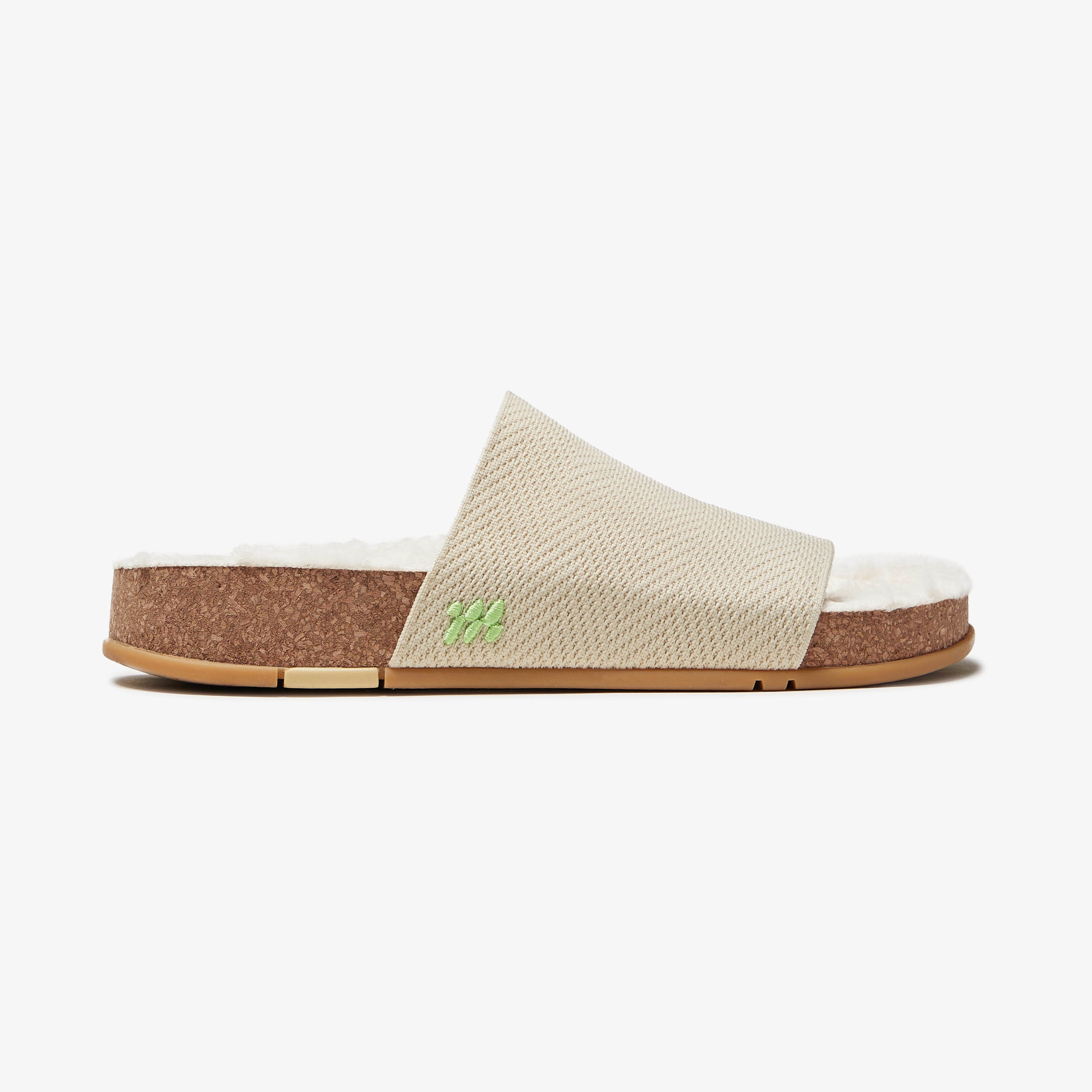 Beige slide sandal with cork sole on a white background