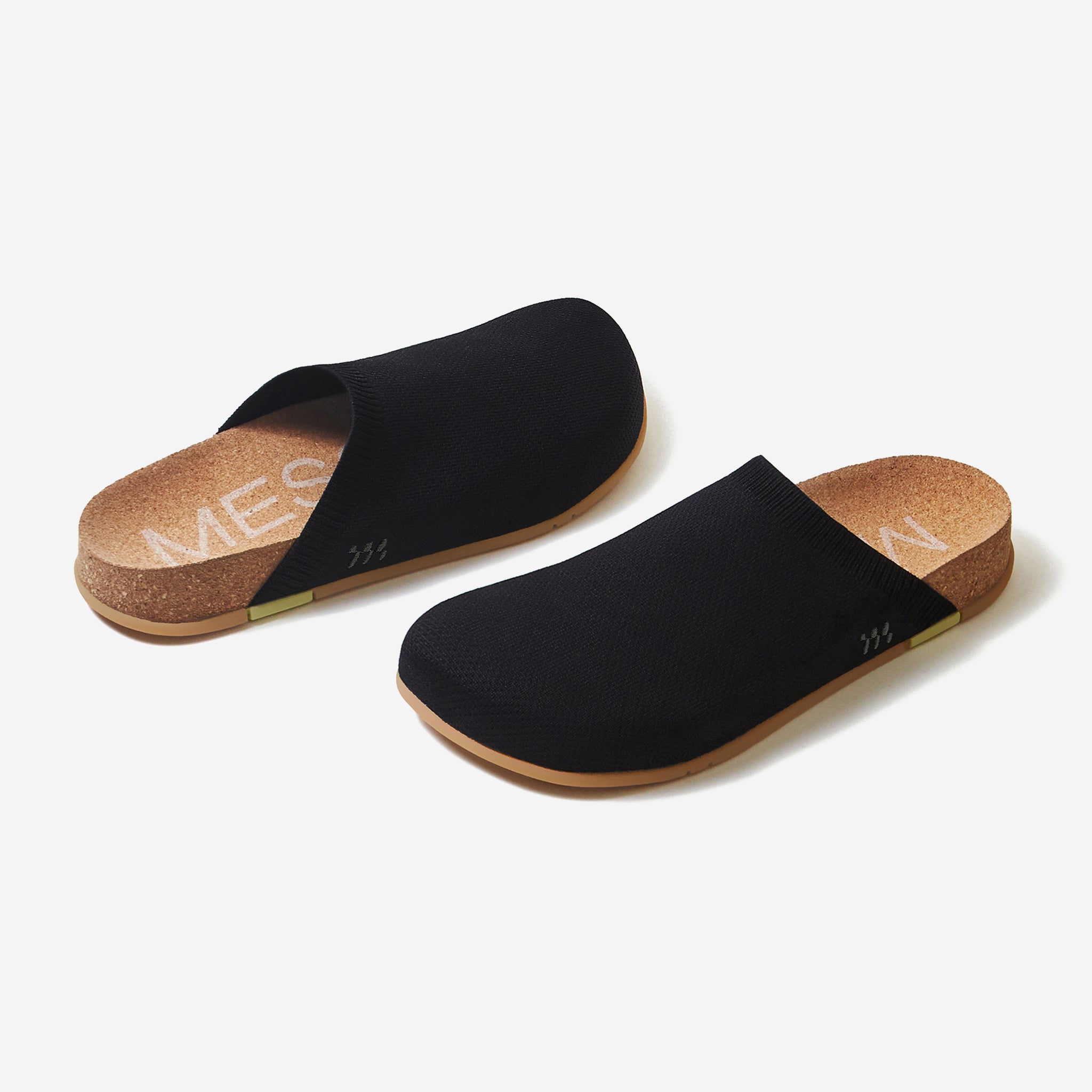 Black slippers with cork sole on a white background