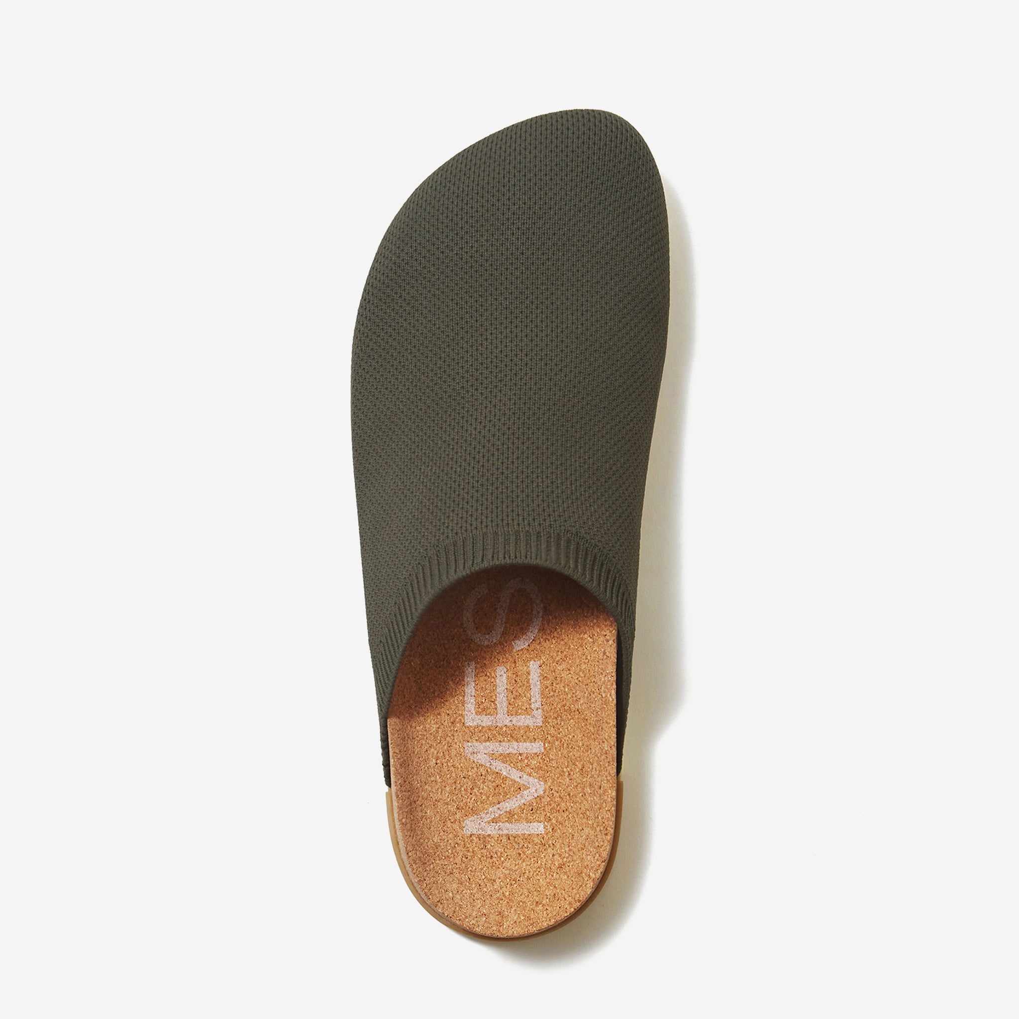 Green shoe insole with brown heel cup on a white background