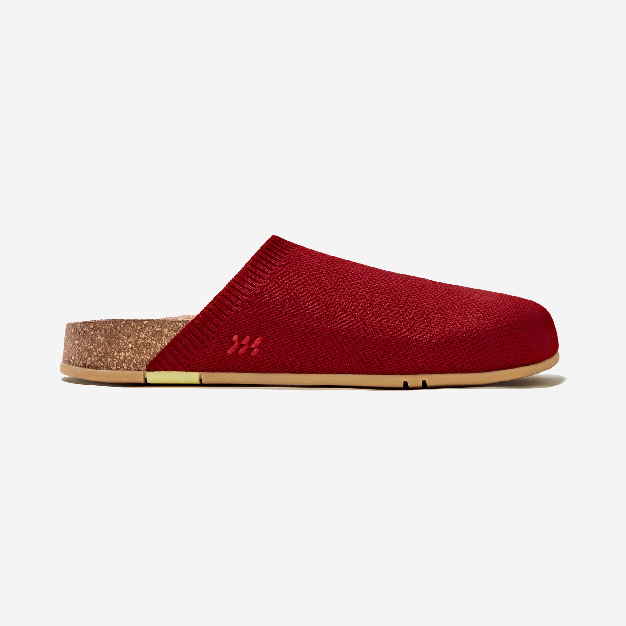 Red slipper with cork sole on a white background