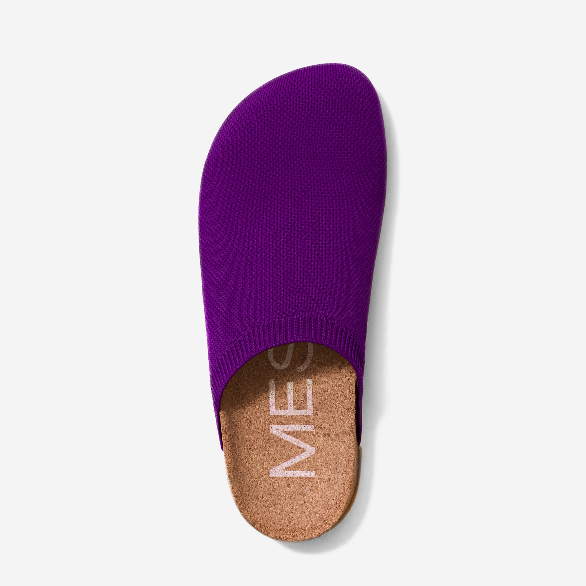 Purple slipper with cork sole on a light gray background