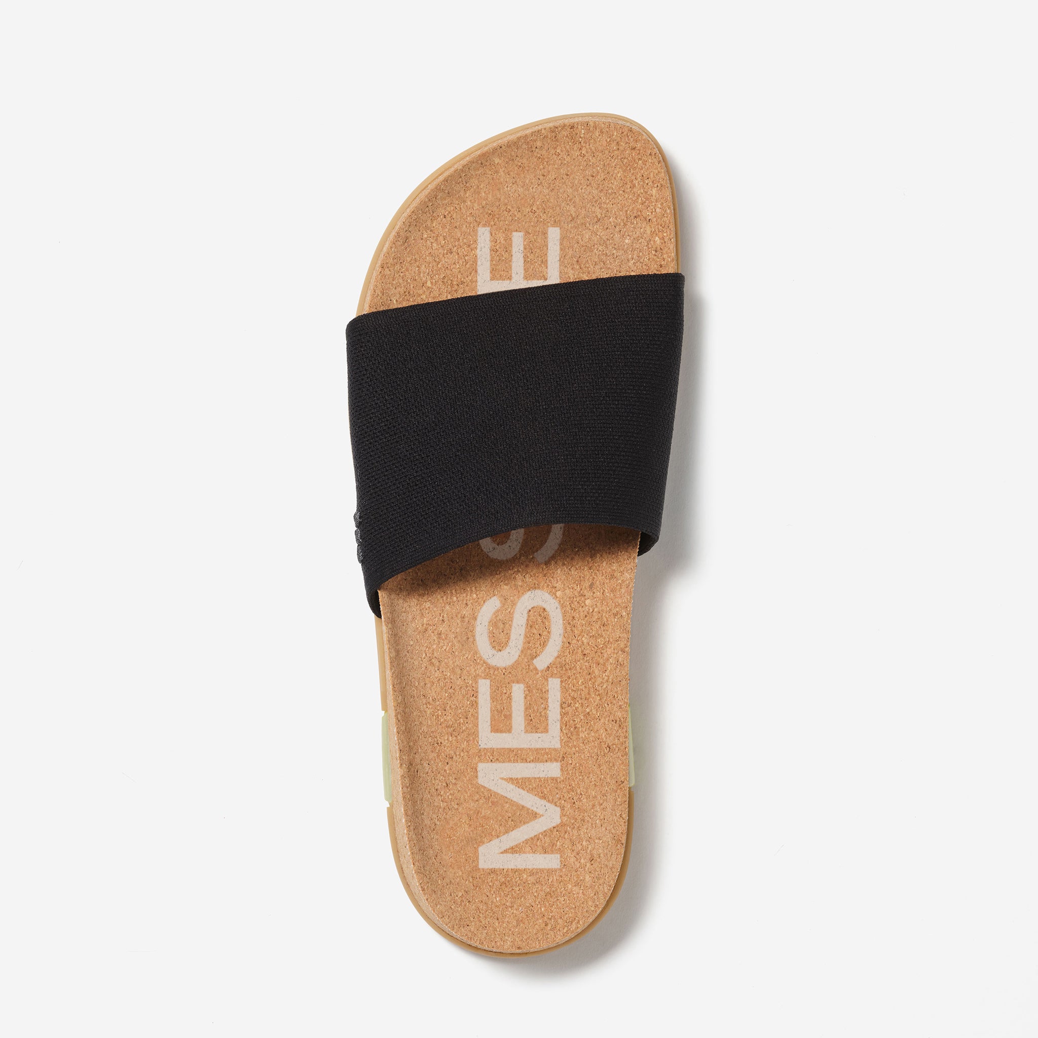 Cork sandal with black strap on a light gray background