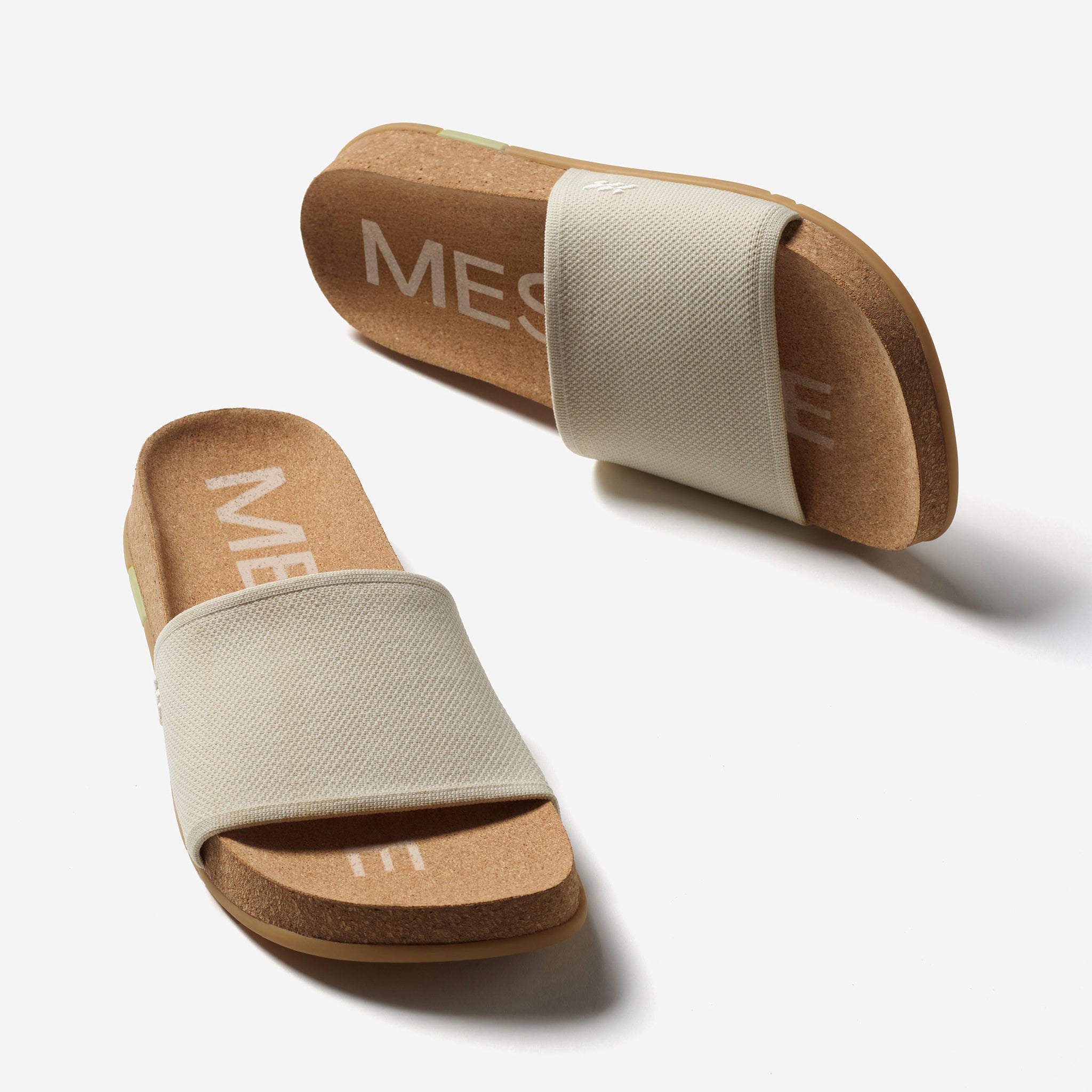 Pair of sandals with white strap on a white background