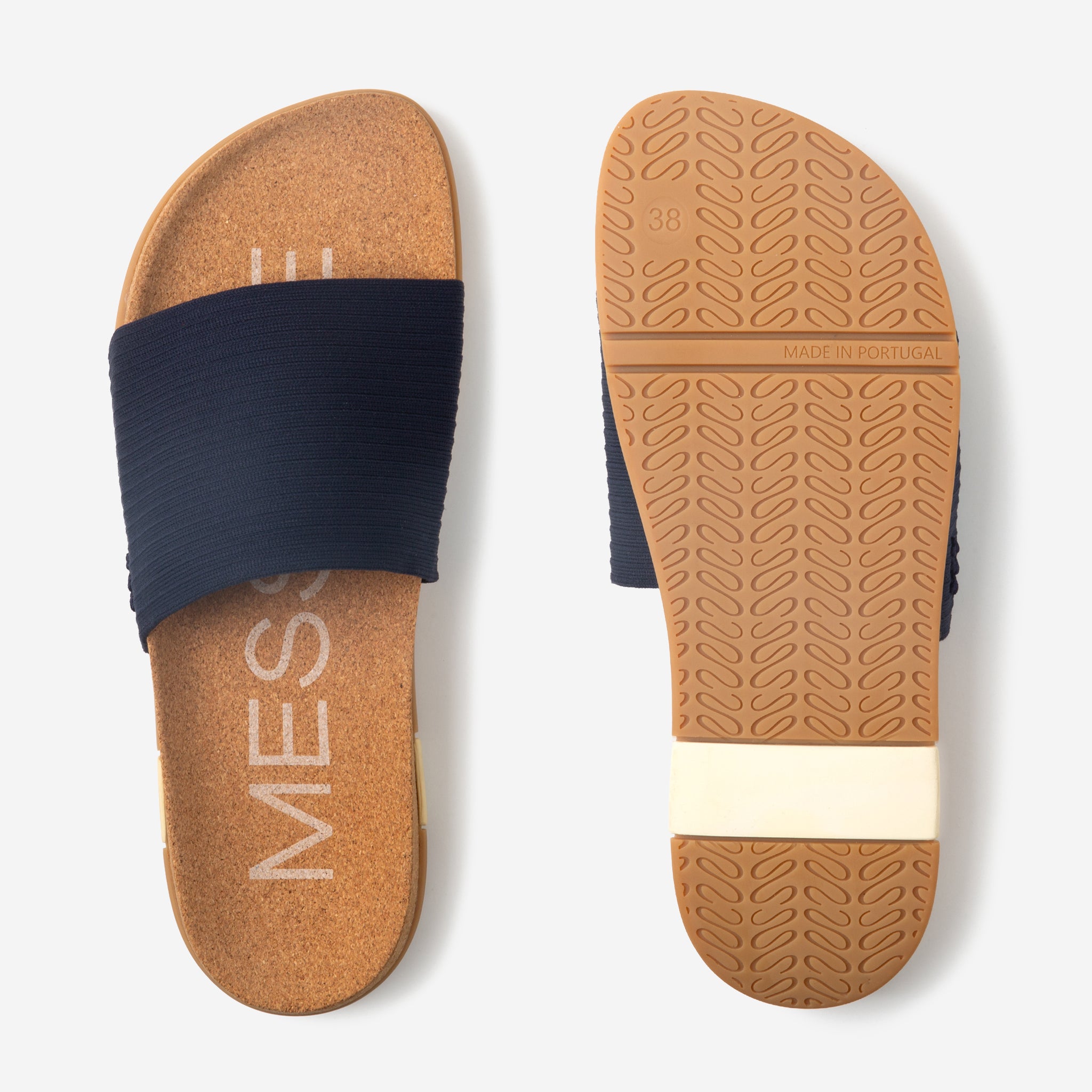 Cork sandal with navy strap on a white background