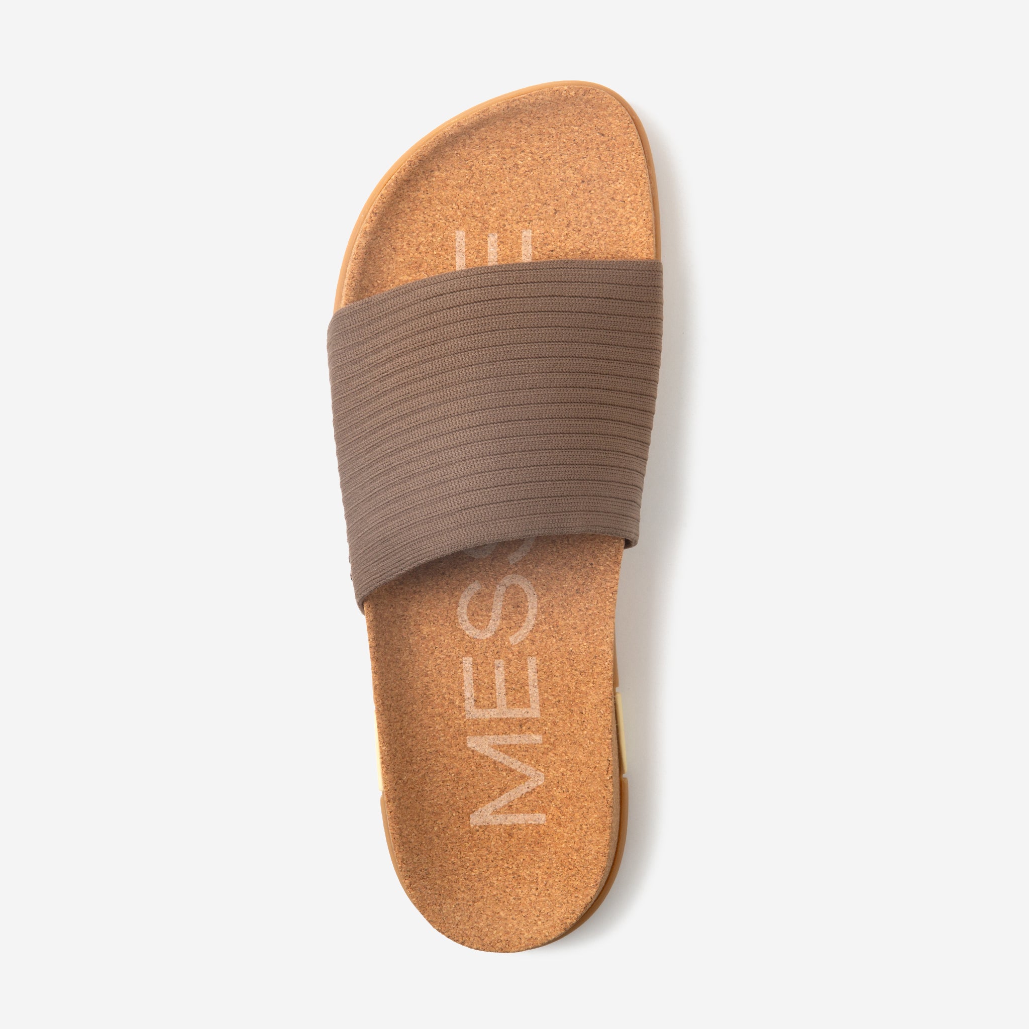 Brown sandal with a brown band on a white background
