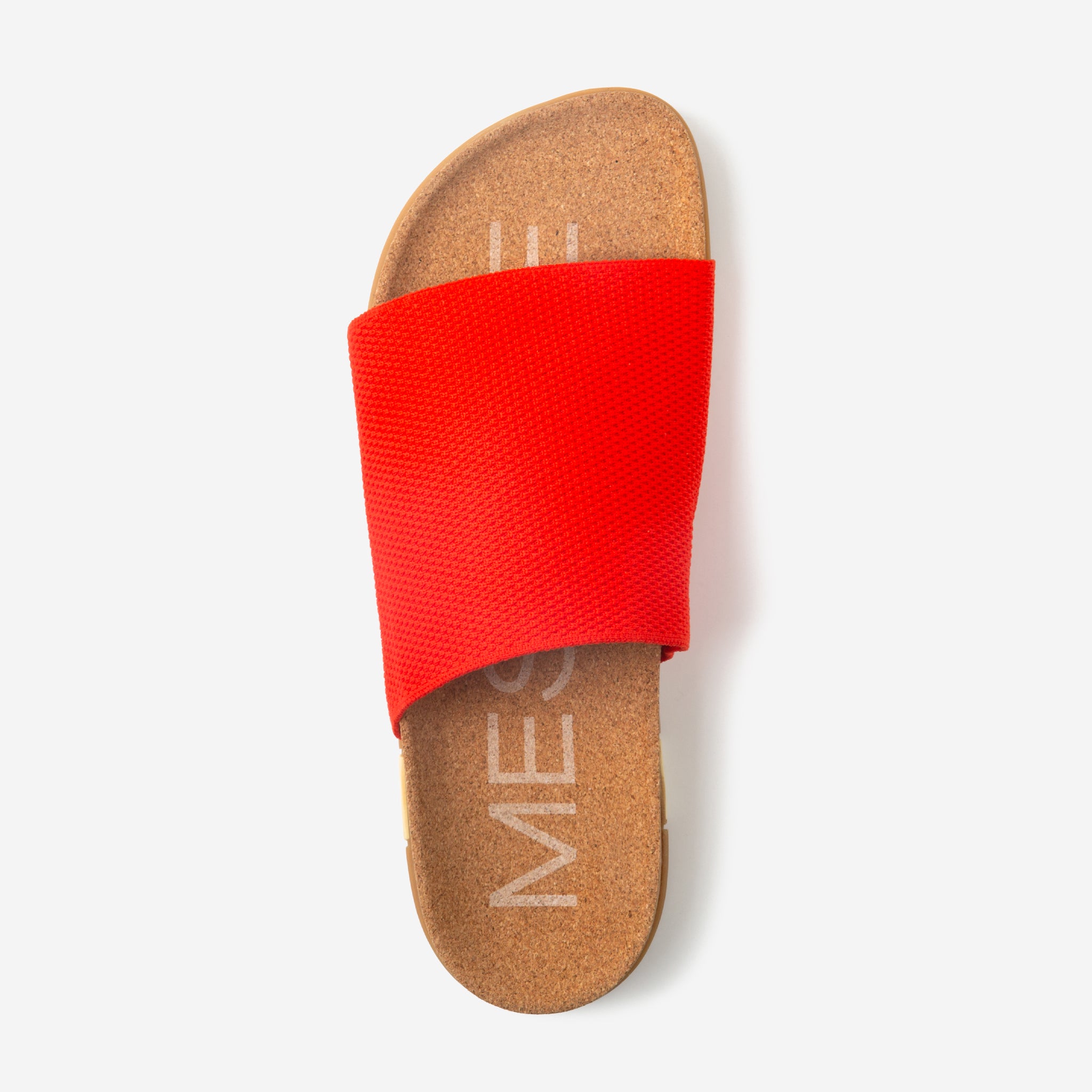 Red slide sandal with cork sole on a white background