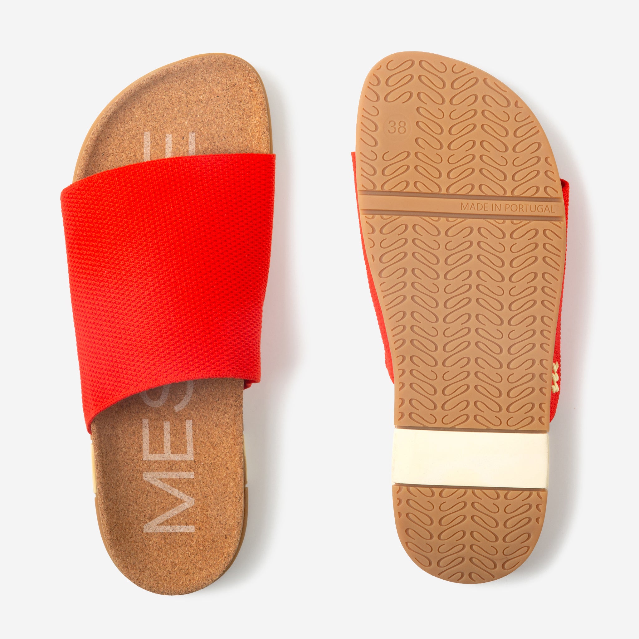 Red slide sandal with cork sole on a white background