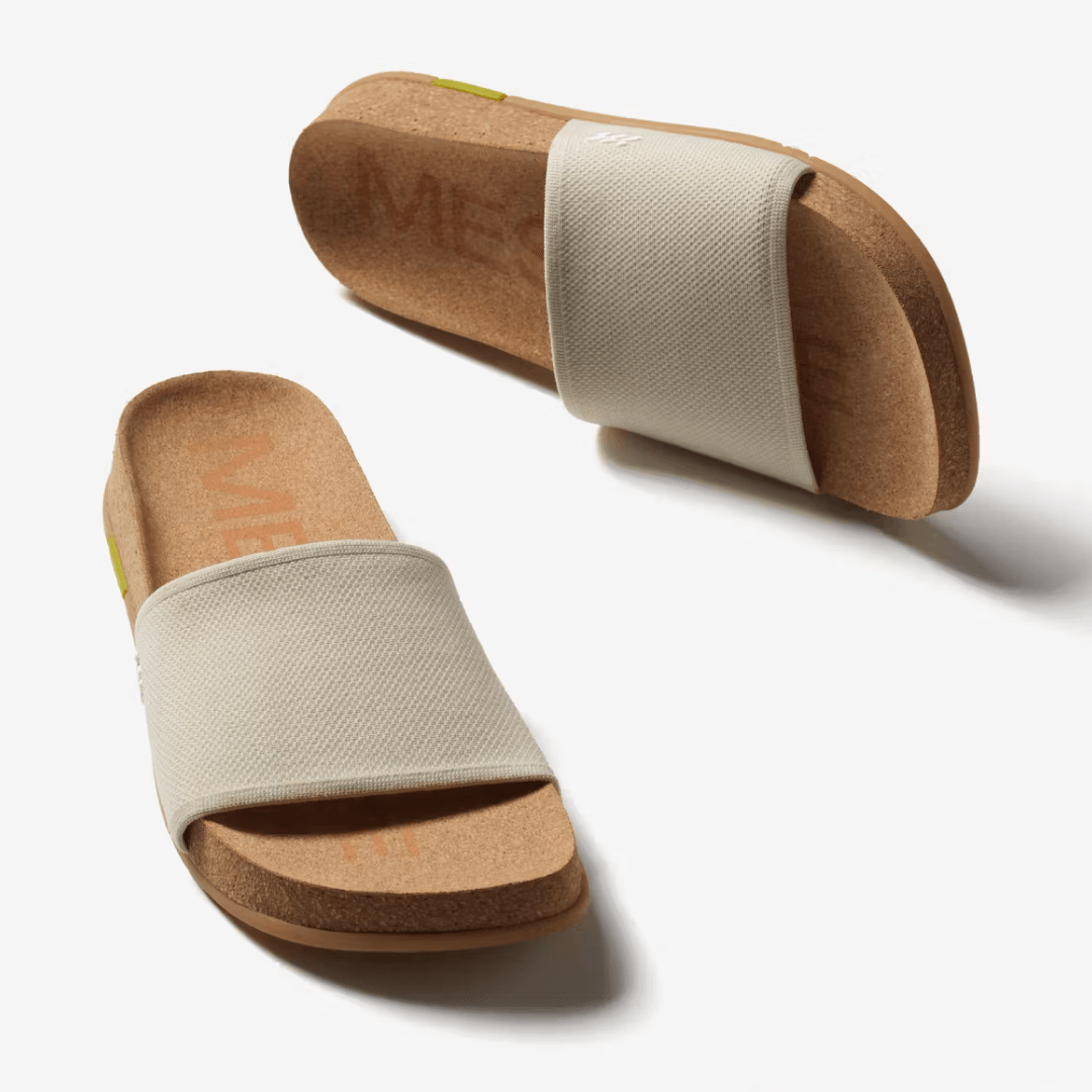Showcasing a pair of creme Mullen Classic Slides