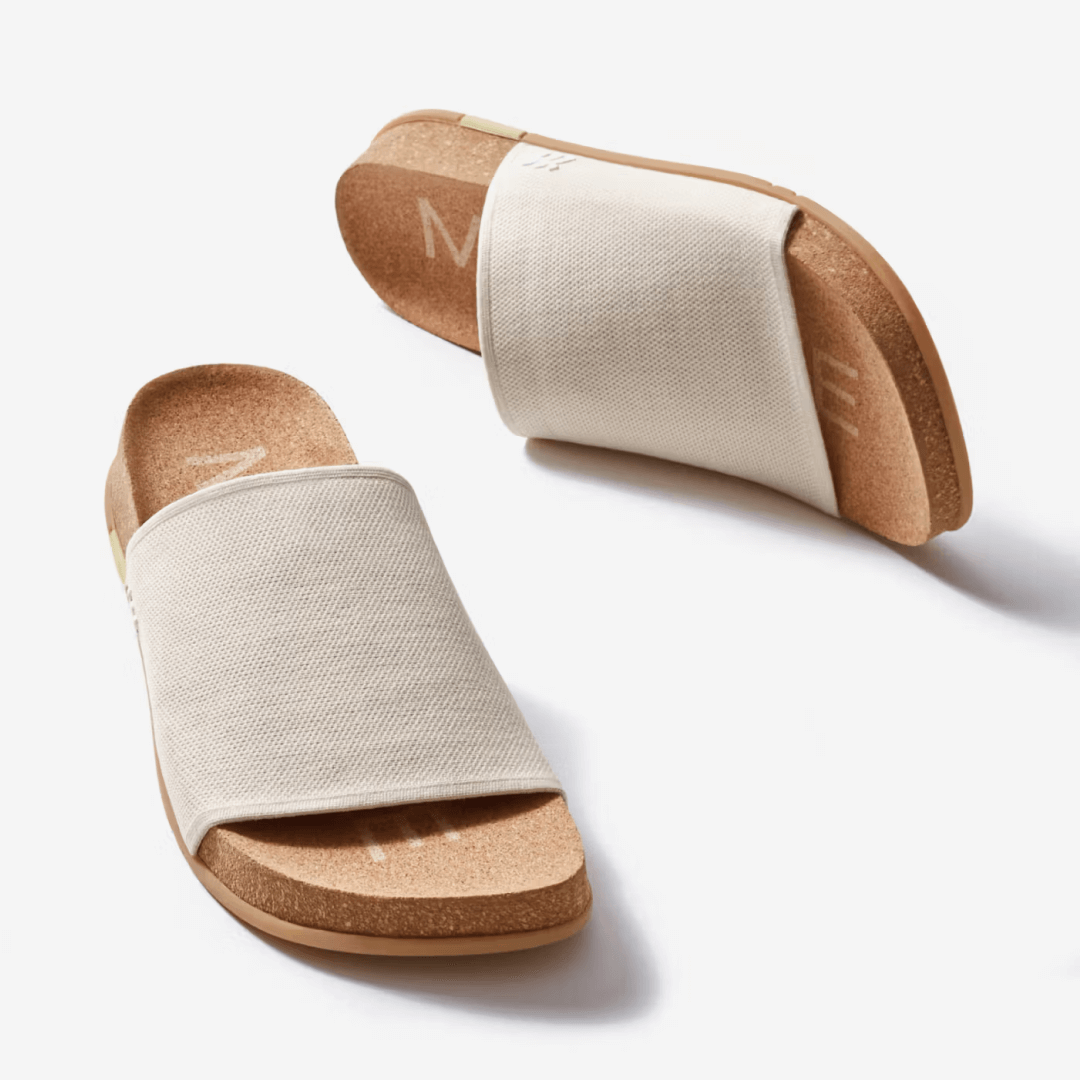 Showcasing a pair of creme Shaw Classic Slides