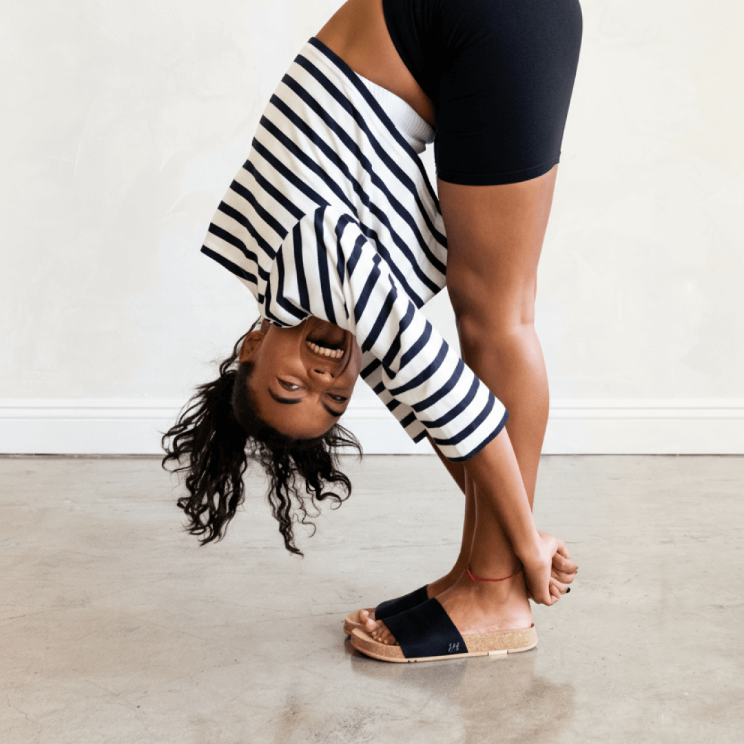 Woman wearing Mullen Classic Slides in black.