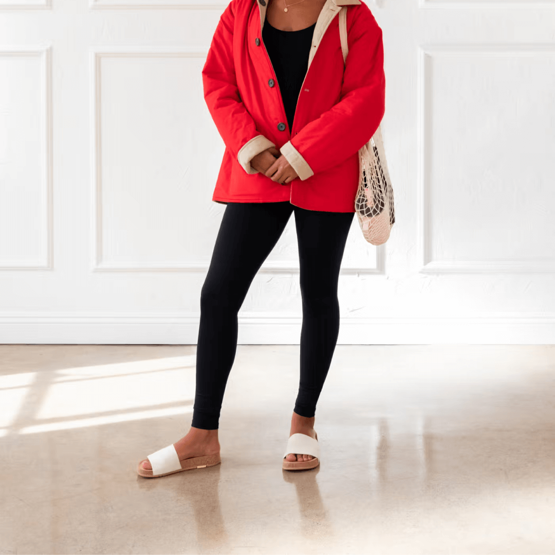 Woman wearing Mullen Classic Slides in creme.