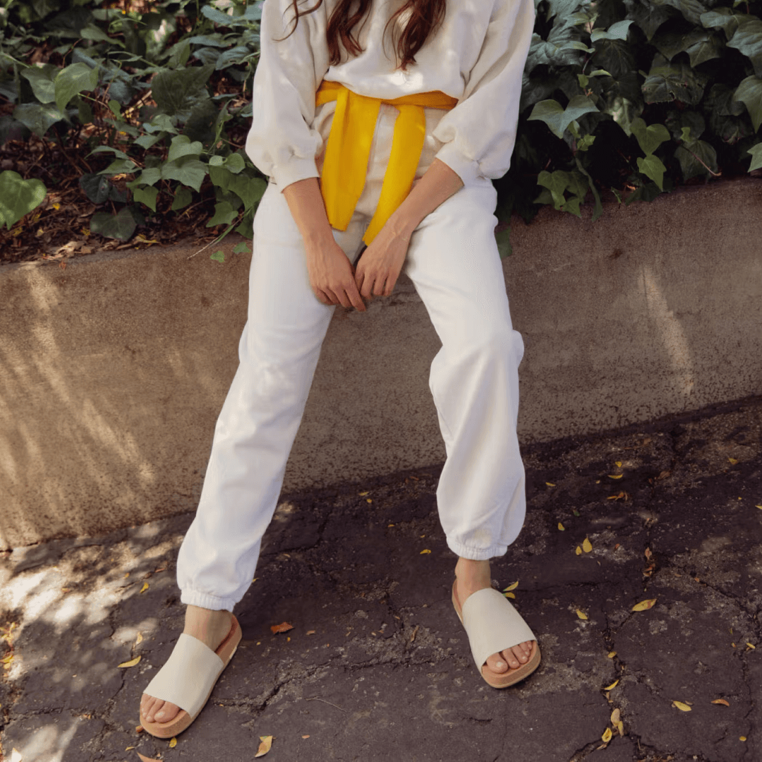 Closeup woman wearing creme Shaw Classic Slide.