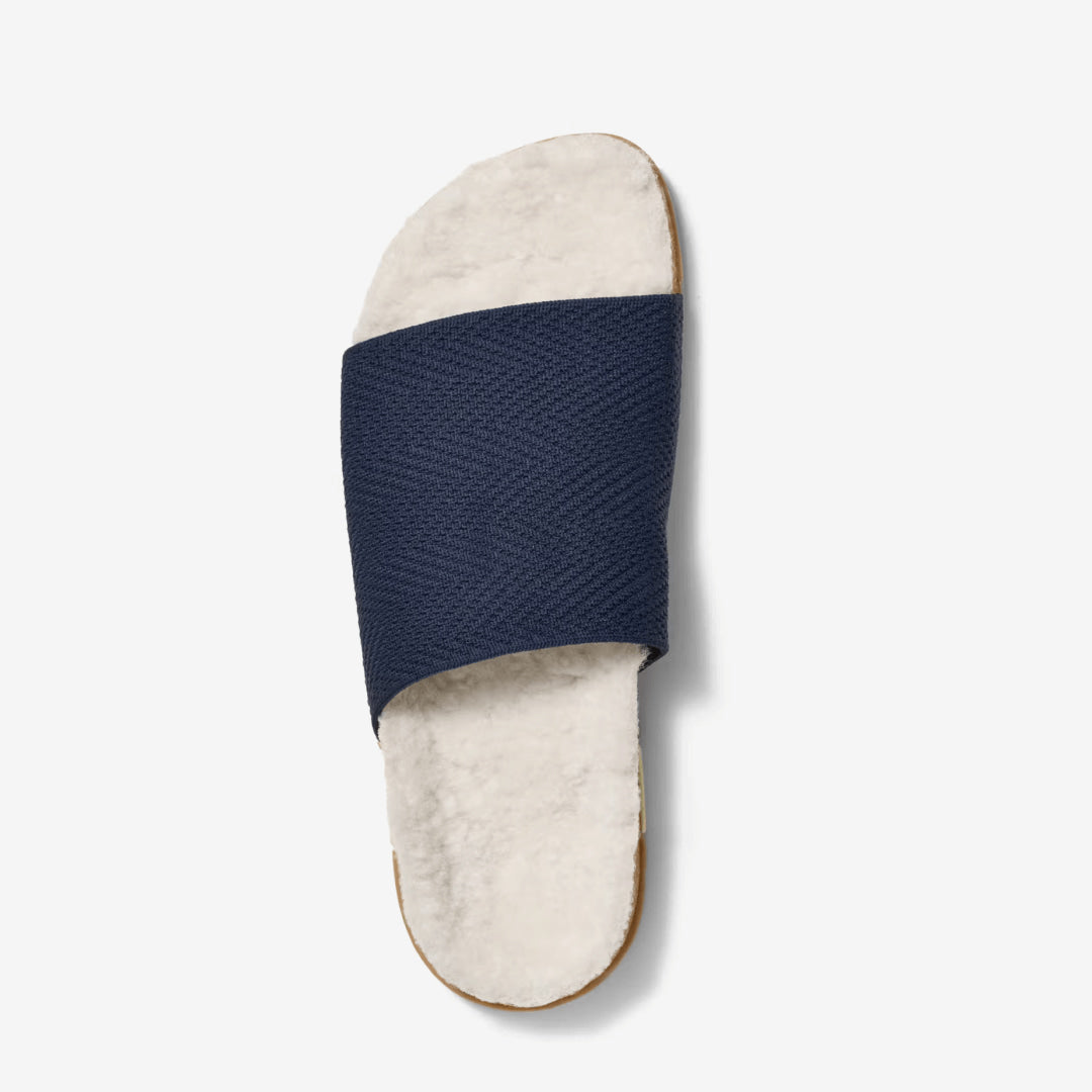 Top view of a MESSAGE Cozy Shaw navy slide in Midnight with a cream vegan shearling lining.