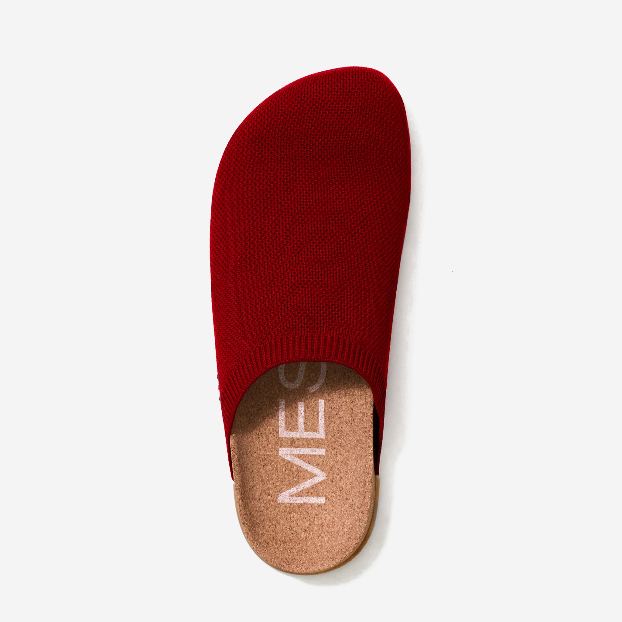 Red slipper with cork sole on a white background