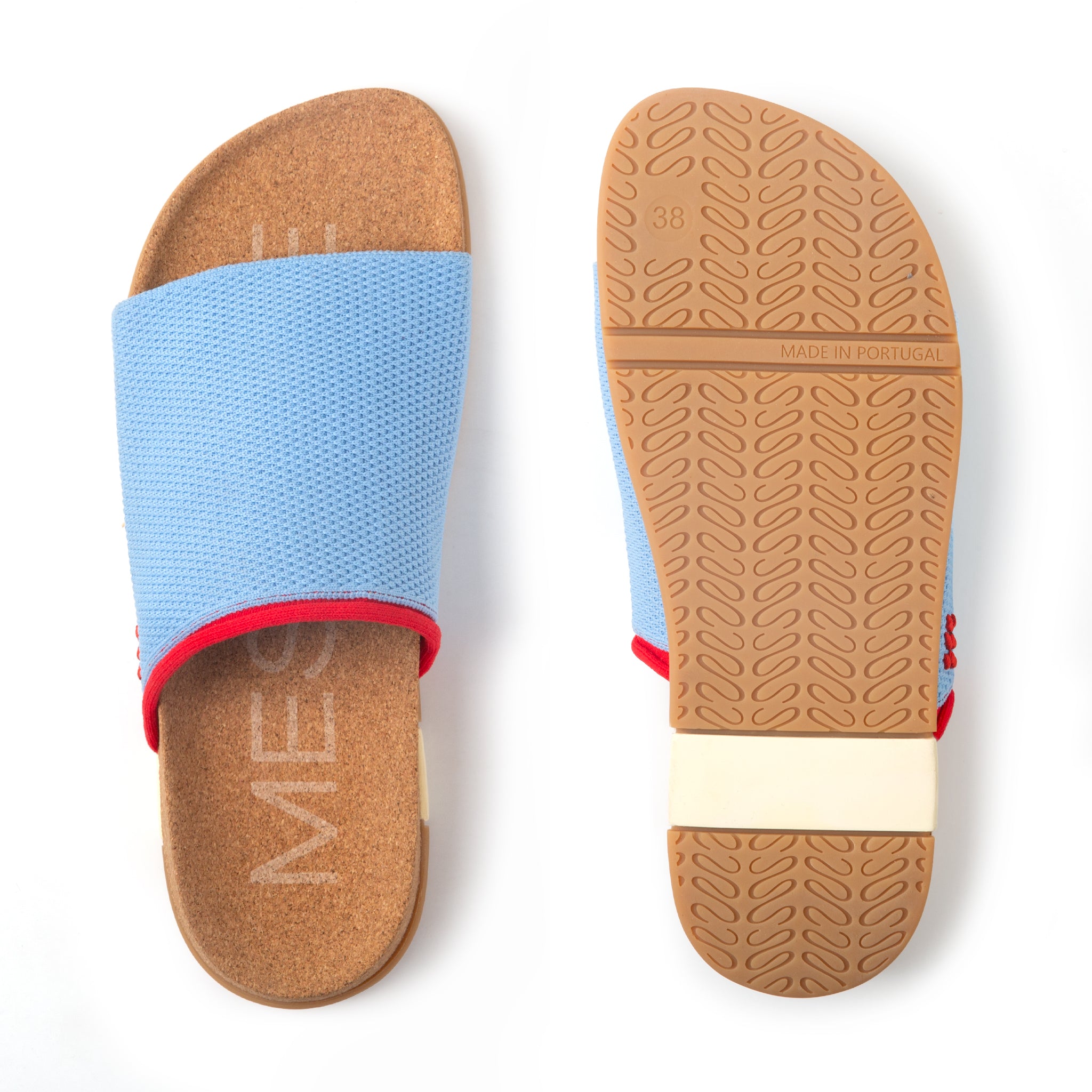 Blue slide sandal with brown sole on a white background