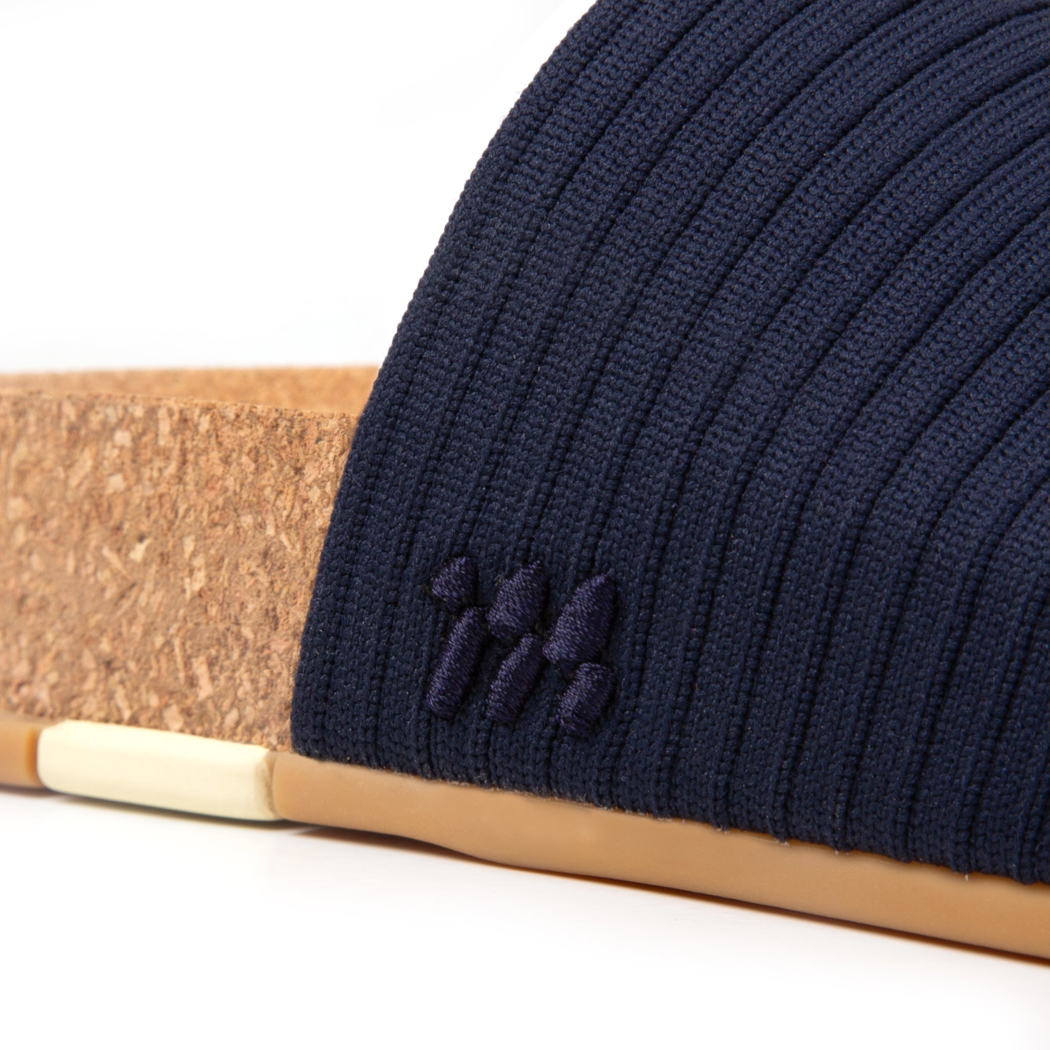 Navy blue beanie with a logo on a white background