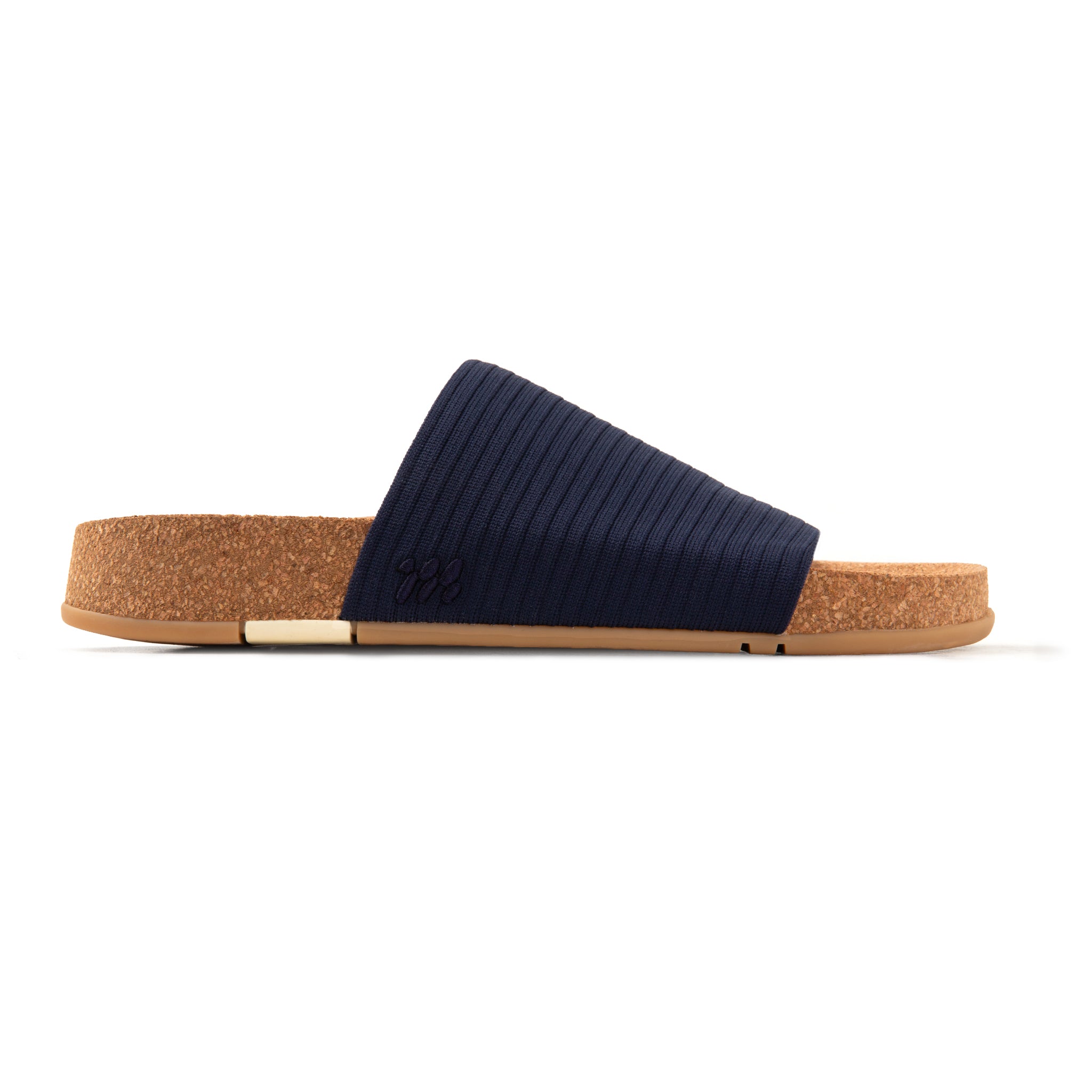 Navy slide sandal with cork sole on a white background