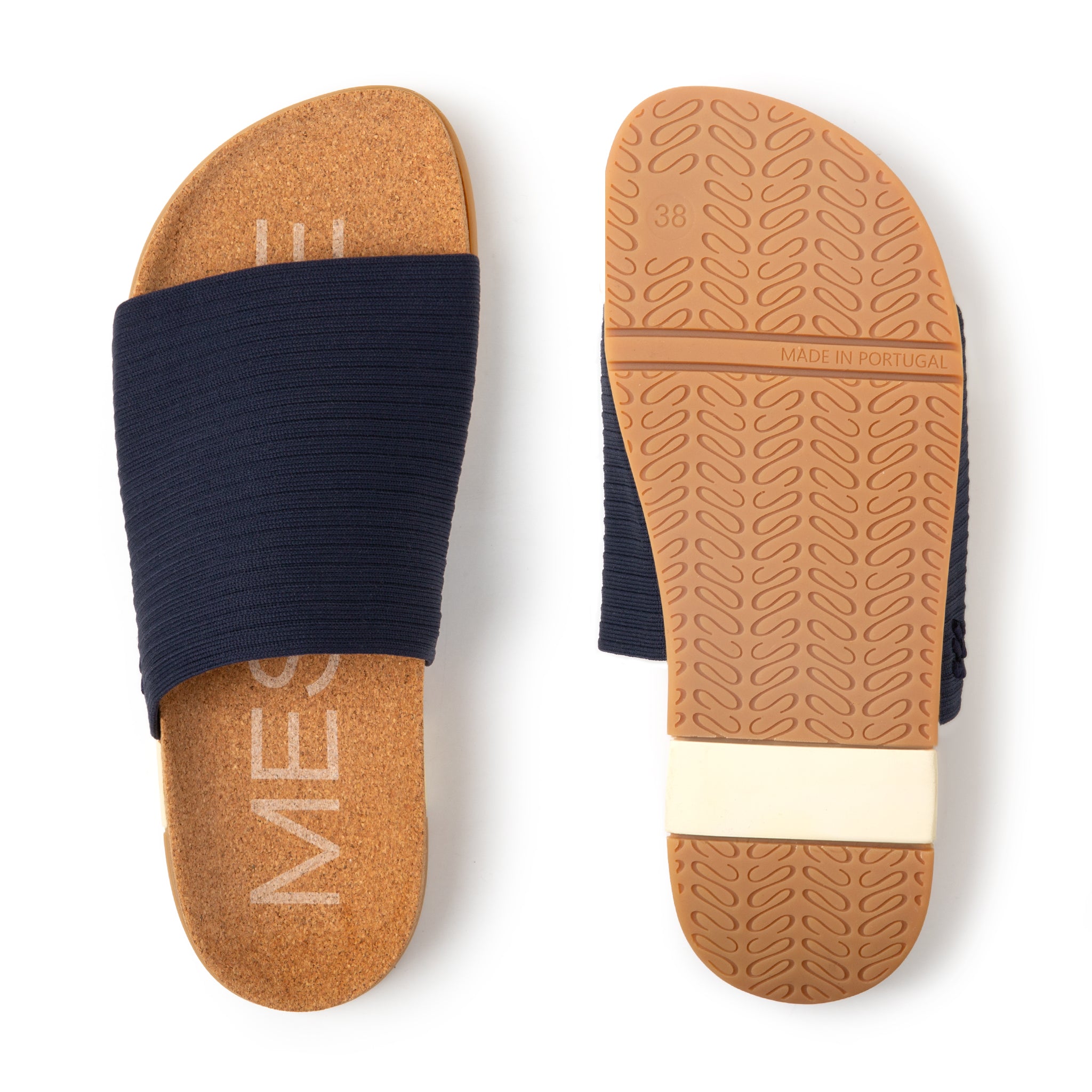 Navy slide sandal with brown sole on a white background
