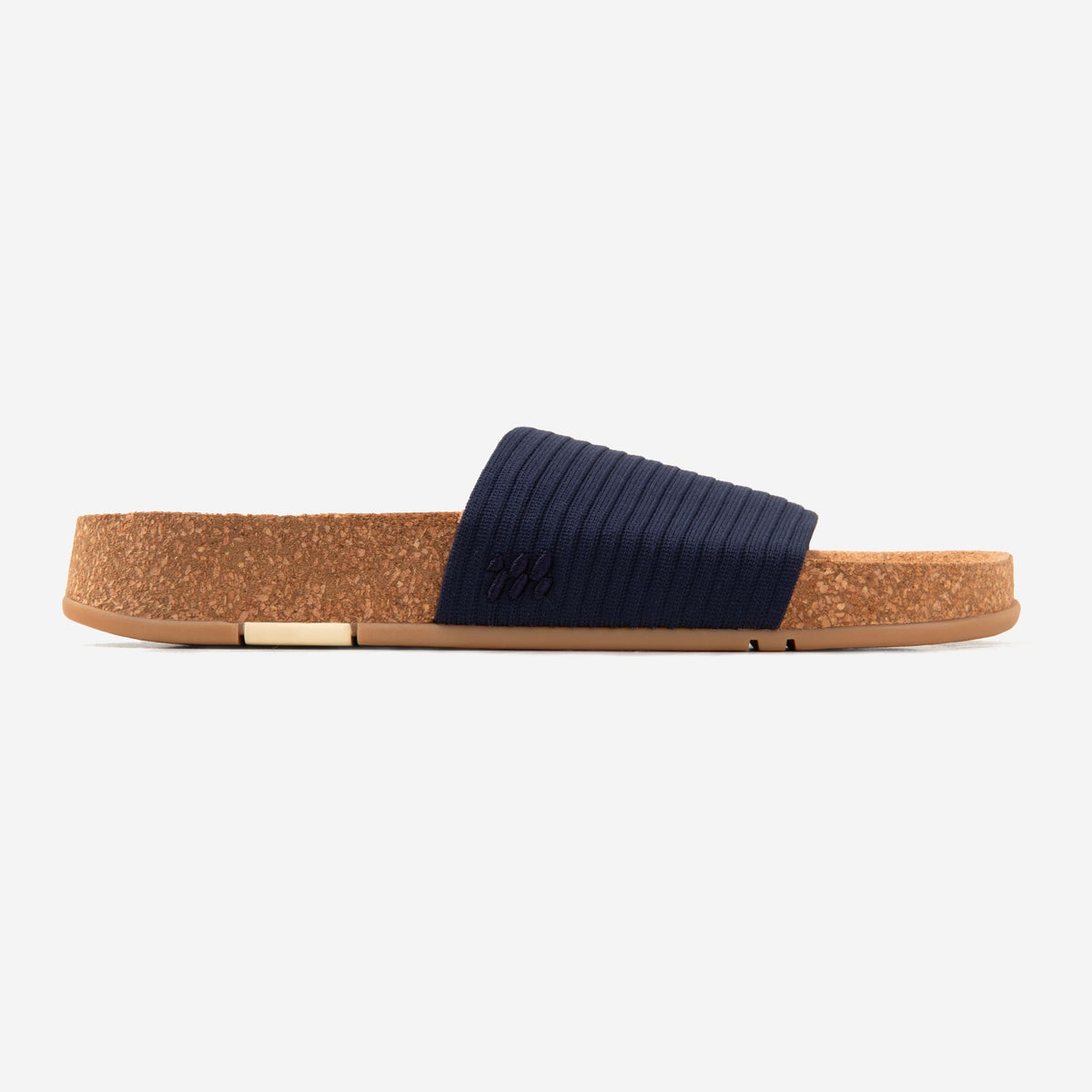 Side profile of a MESSAGE Mullen Ripple navy slide in Midnight with short strap and cork footbed.