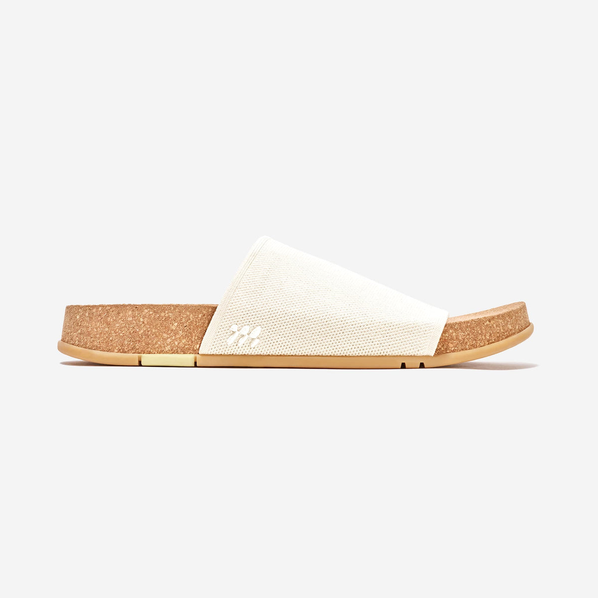 MESSAGE Shaw Classic cream slide in Creme Brulee, profile with longer knit strap and cork footbed.