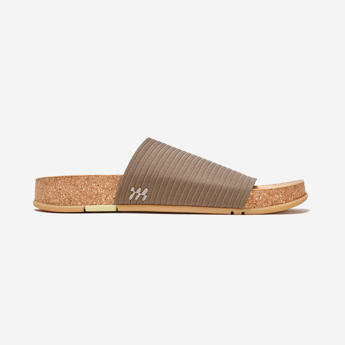 MESSAGE Shaw Ripple slide in Stone taupe with textured knit strap and cork footbed, side view.