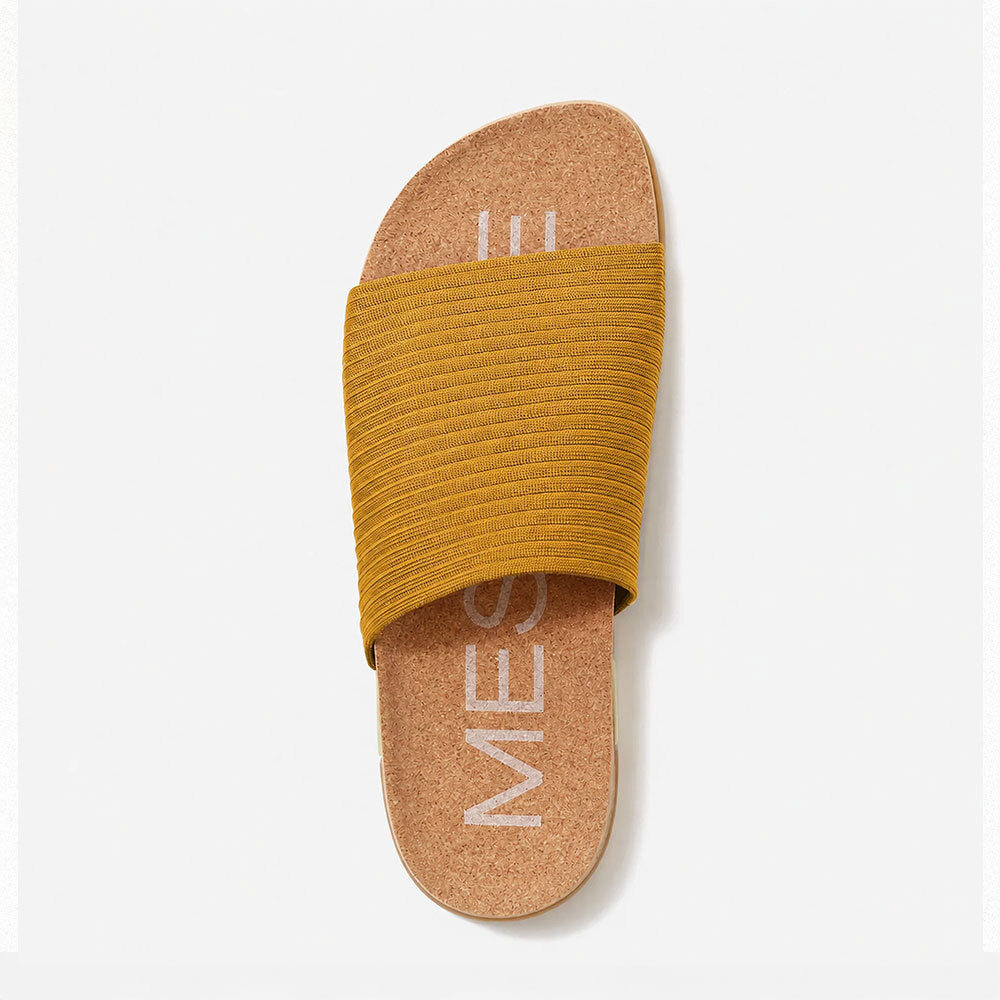 MESSAGE Shaw slide in Golden with cork footbed, top view close-up.